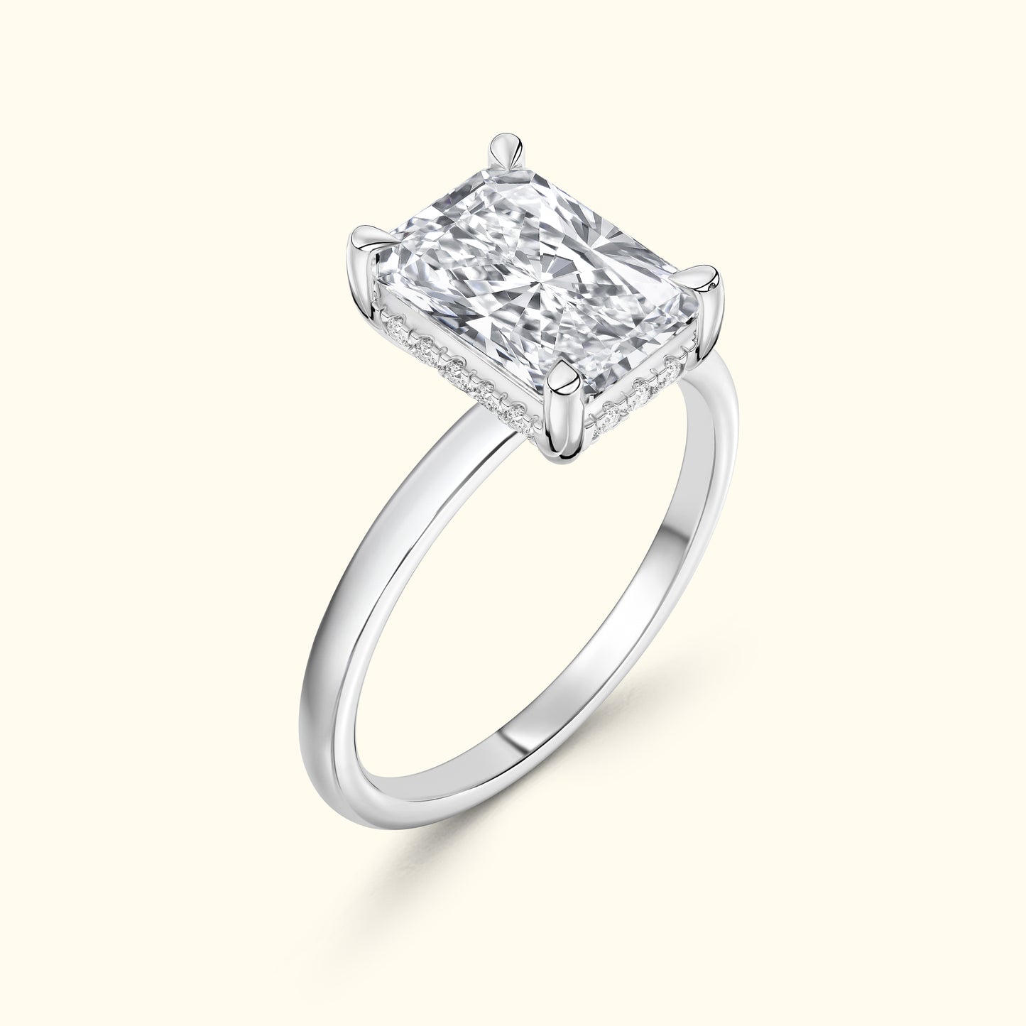 Elegant silver engagement ring featuring a large rectangular diamond.