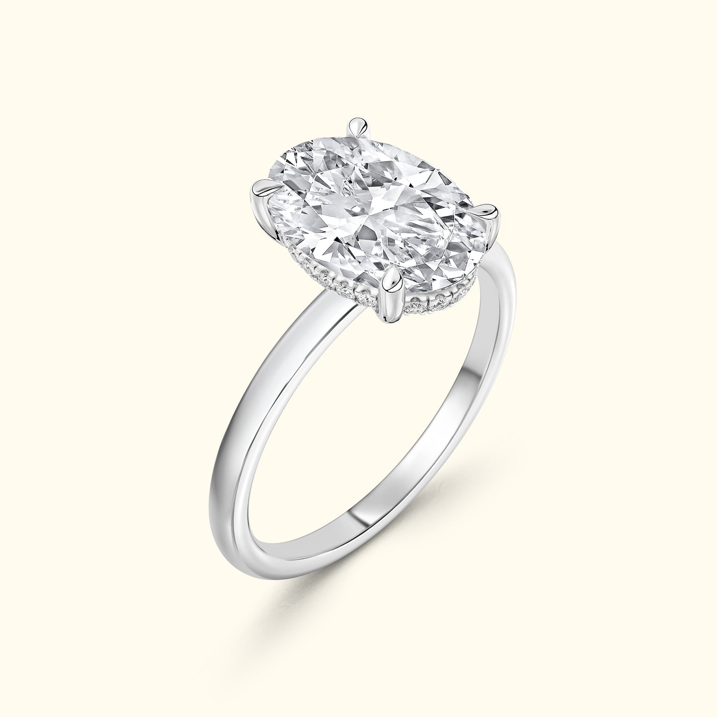 Oval diamond engagement ring with a polished silver band.