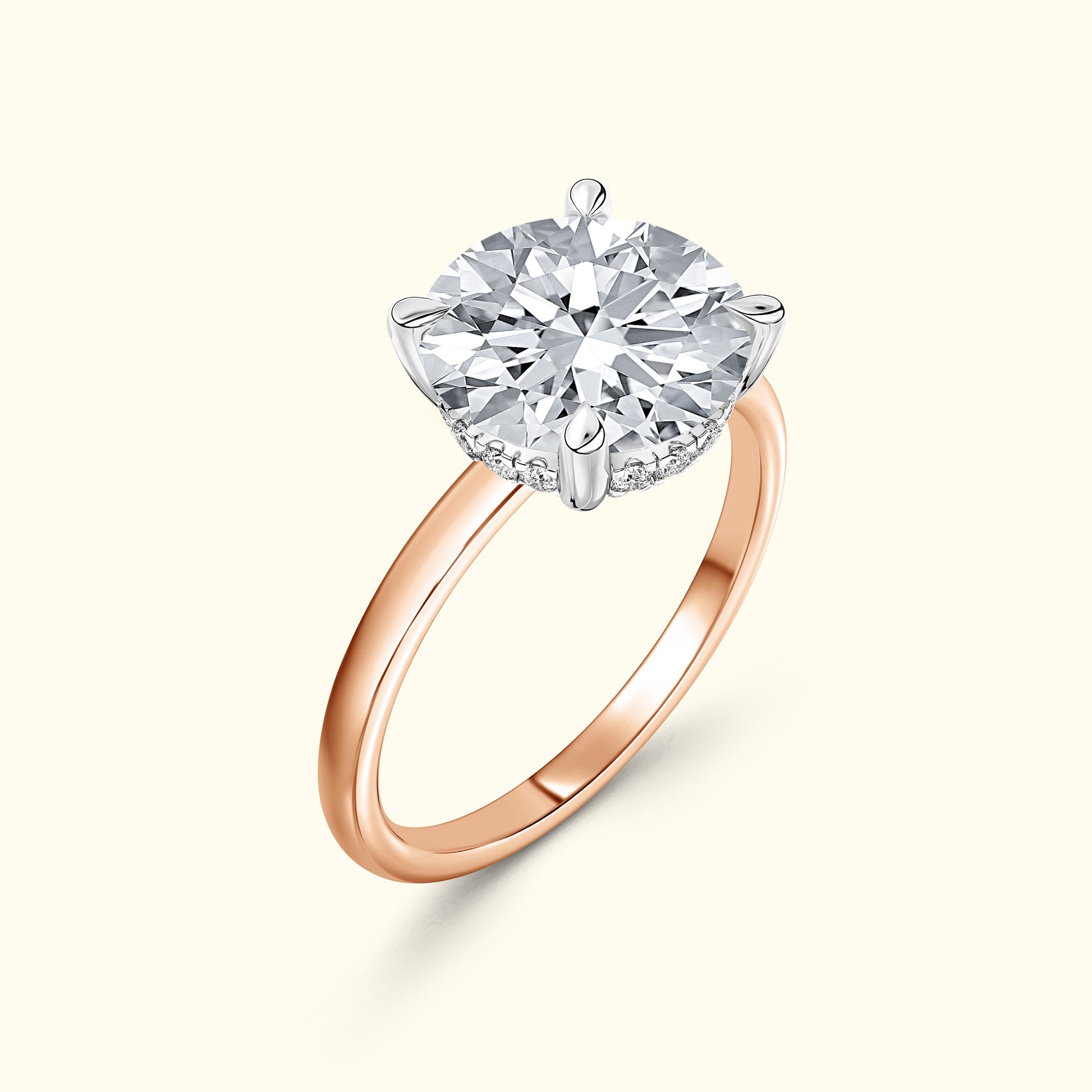 Rose gold engagement ring featuring a large round diamond centerpiece.