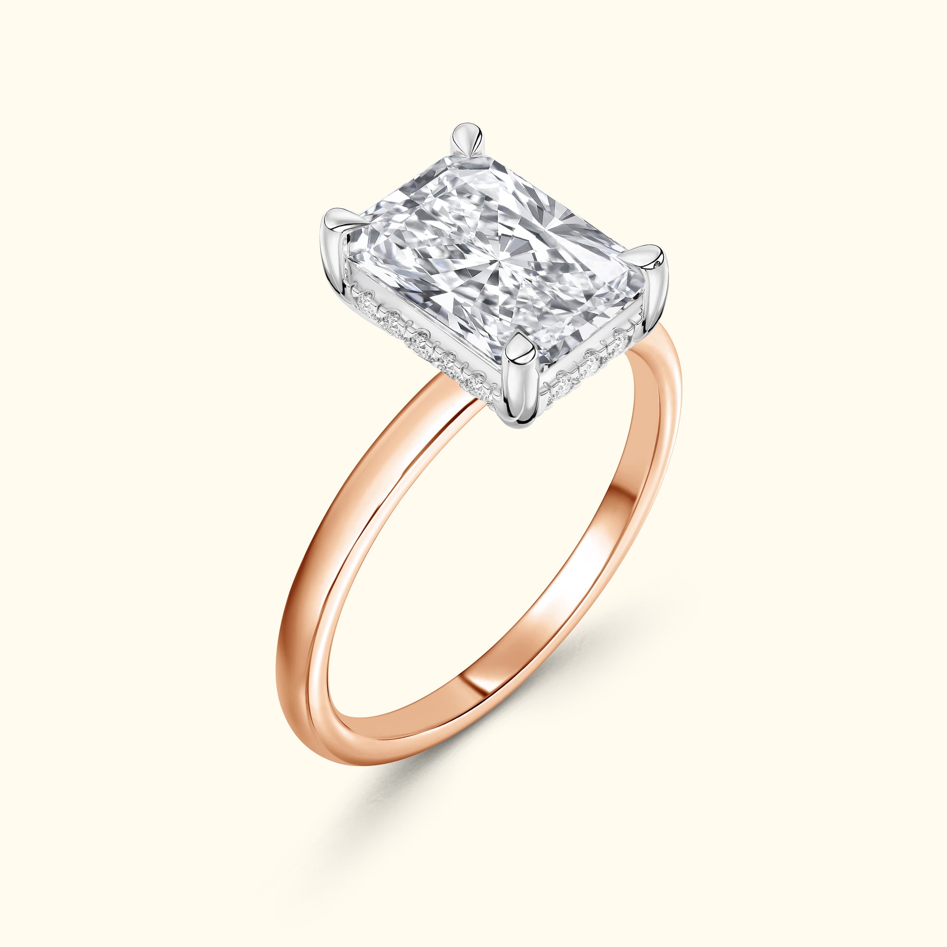 Square diamond ring with a rose gold band and intricate detailing.