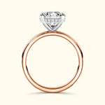 Solitaire engagement ring featuring a large diamond atop a rose gold band.