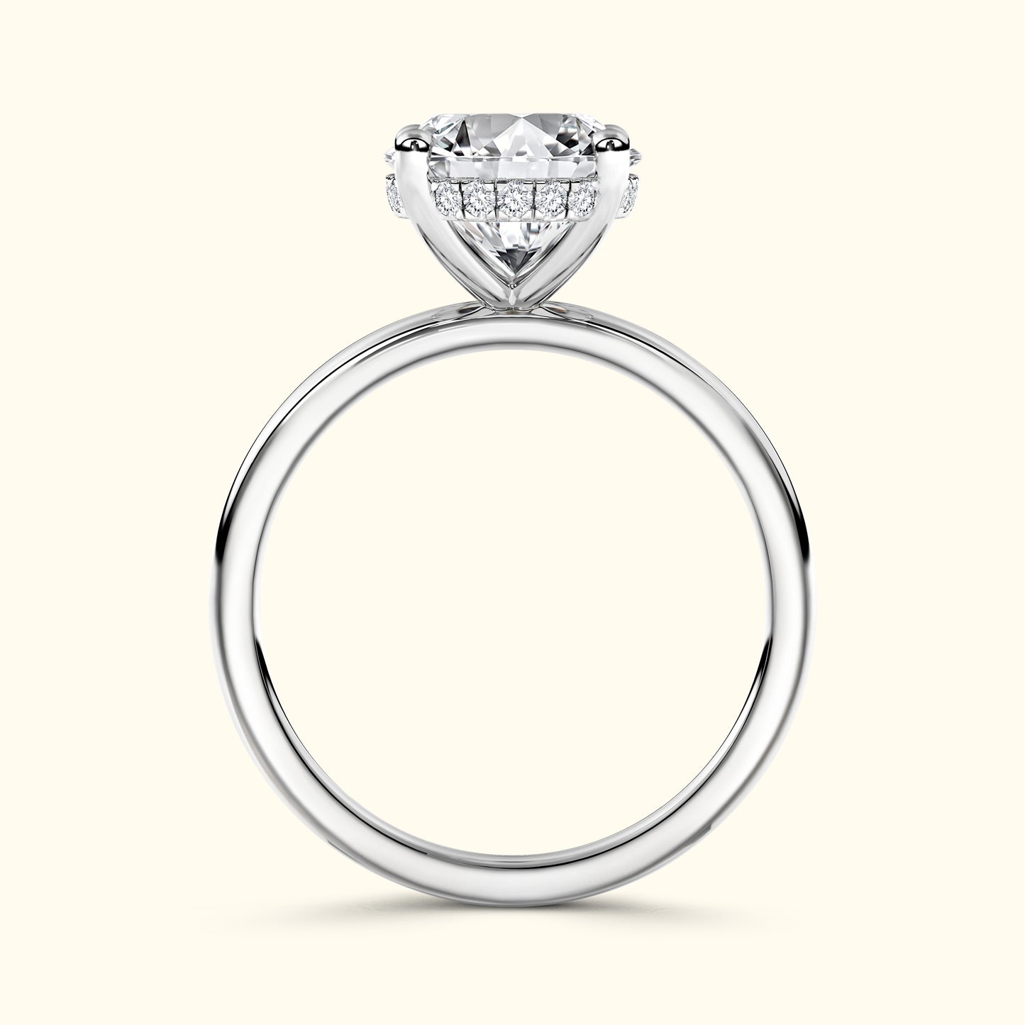 Solitaire ring with a large round diamond and smaller sidelights on a smooth silver band.