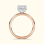 Rose gold ring featuring a rectangular diamond setting and four smaller diamonds.