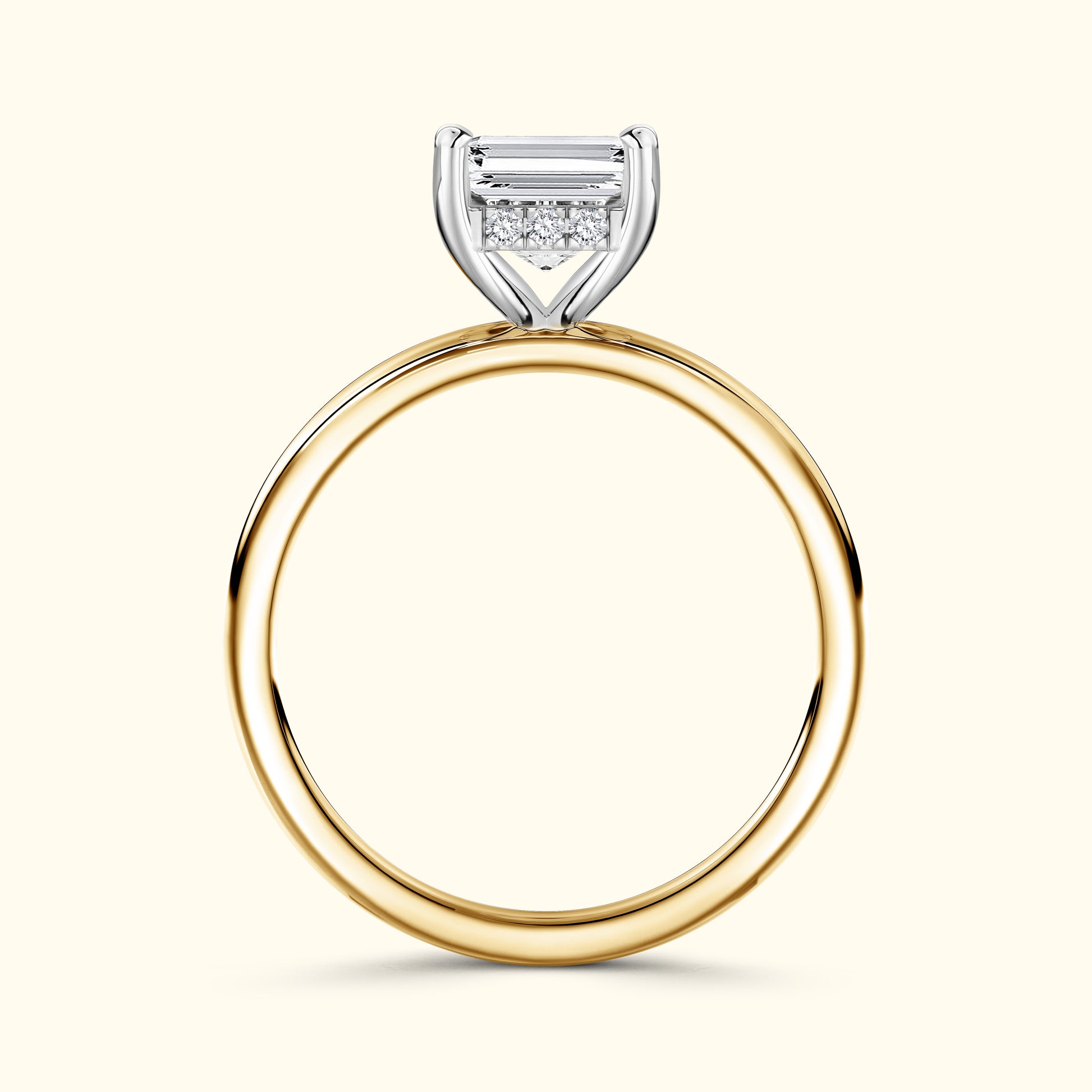 Gold and silver engagement ring with a rectangular diamond and smaller accent stones.