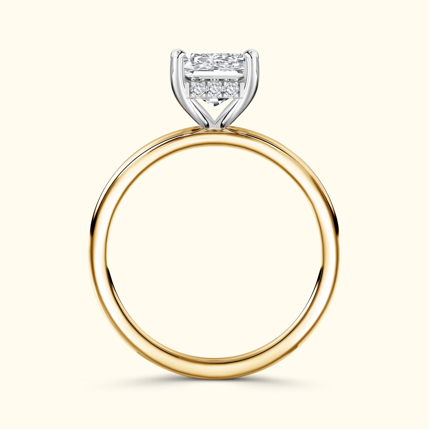 Gold and silver engagement ring with a large rectangular diamond setting.