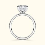 Elegant solitaire diamond ring with a round cut stone and slender band.