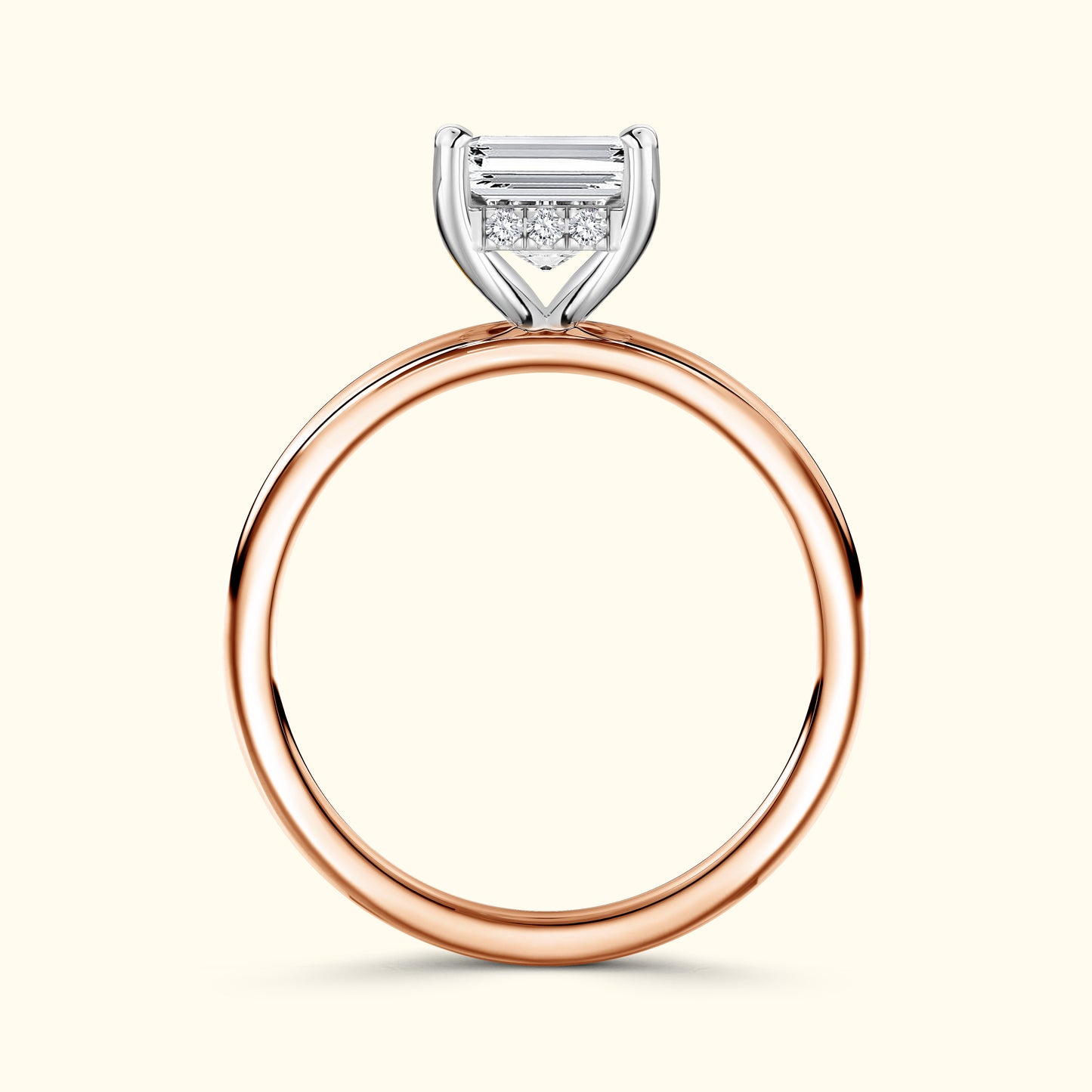 Rose gold ring featuring a rectangular diamond and smaller accent stones.