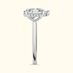 Elegant silver ring with a large center diamond and smaller diamonds accenting the band.