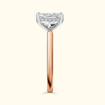 Rose gold and silver engagement ring with a prominent diamond setting.