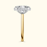 Elegant diamond engagement ring with a gold band and sparkling side accents.