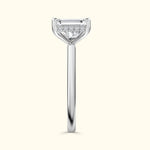Elegant solitaire engagement ring with a clear diamond and sleek silver band.