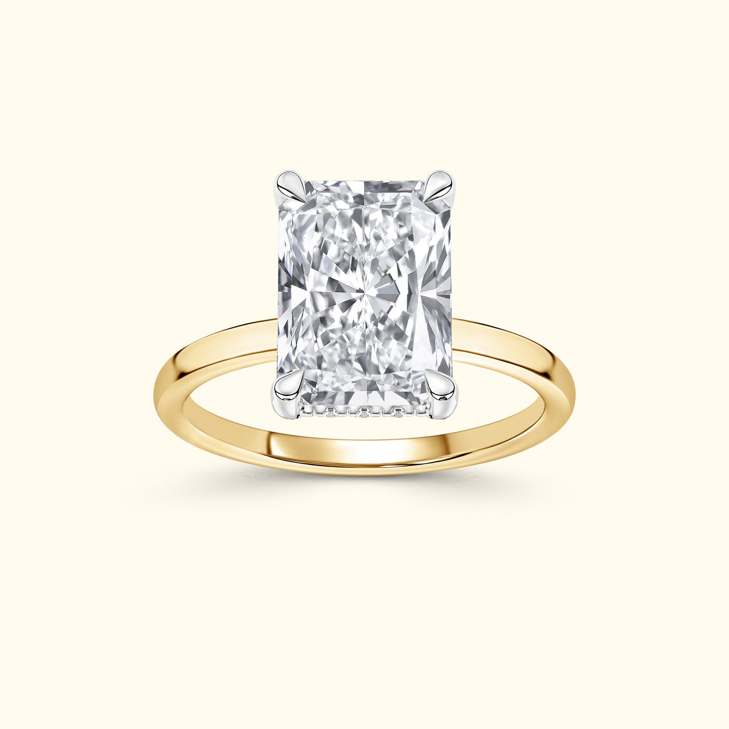 Rectangular diamond engagement ring with a yellow gold band.