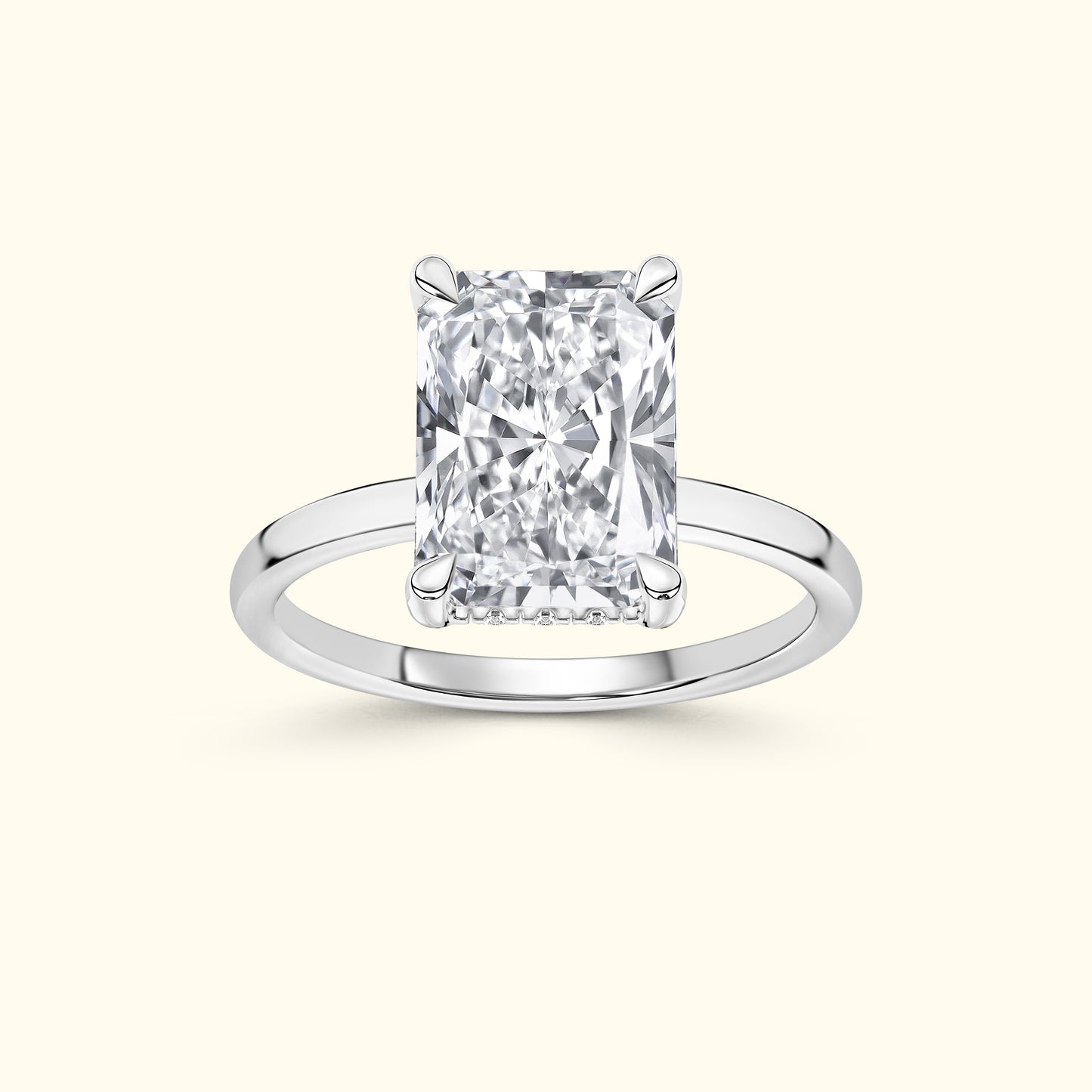 Elegant silver ring featuring a large rectangular diamond set in four prongs.