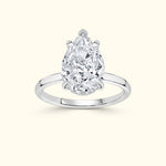 Elegant pear-shaped diamond ring set in a sleek white gold band.