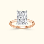 Rectangular diamond ring set in rose gold.