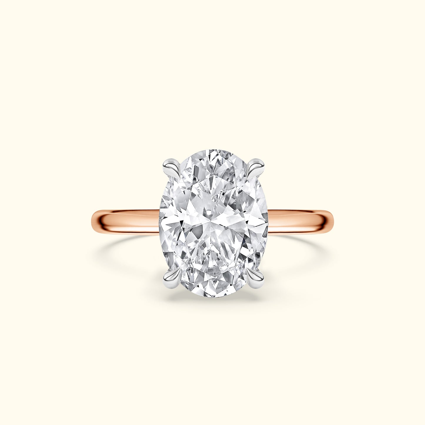 Oval diamond engagement ring with a rose gold band.