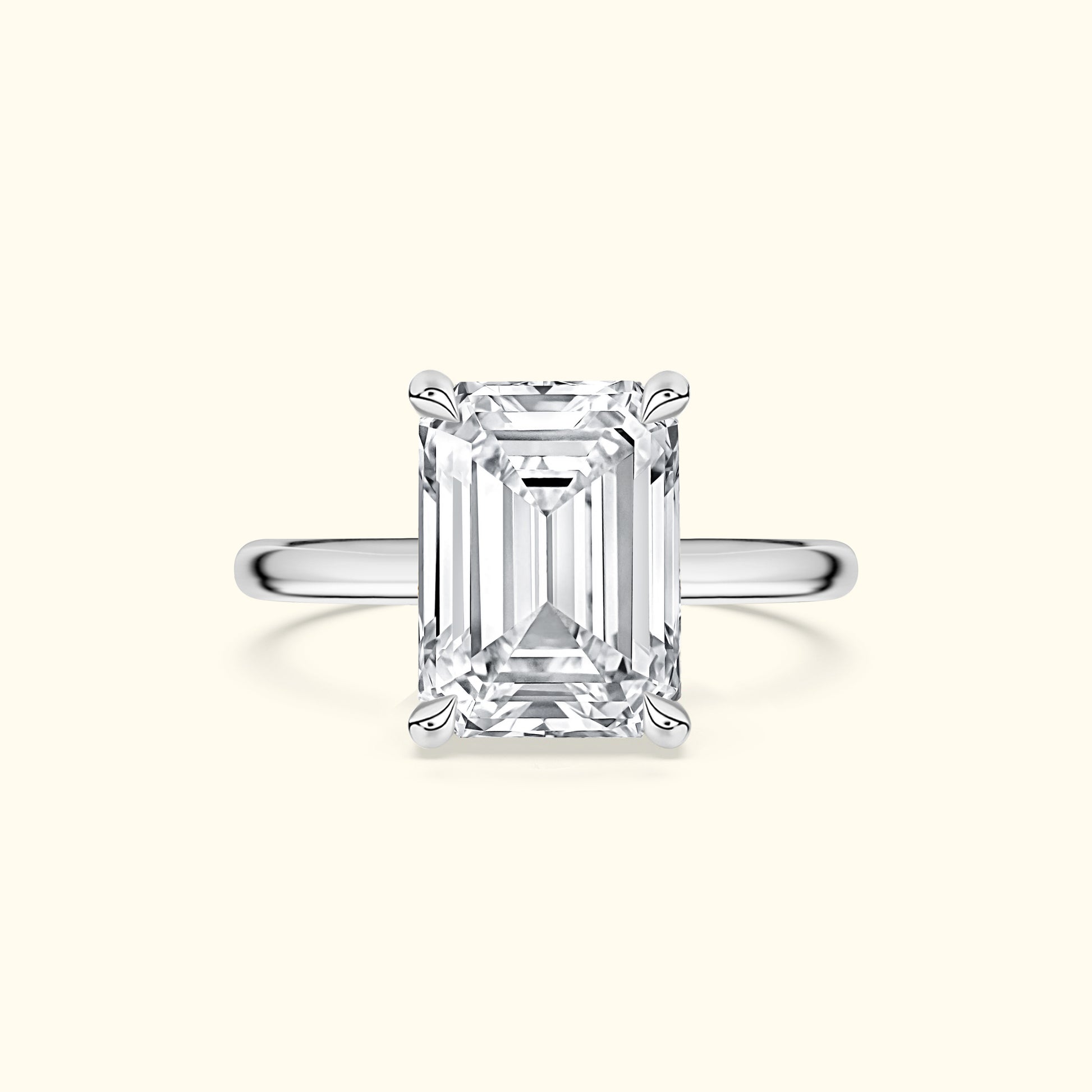 Elegant wide band ring featuring a large rectangular diamond centerpiece.