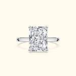 Elegant silver ring featuring a large rectangular diamond centerpiece.
