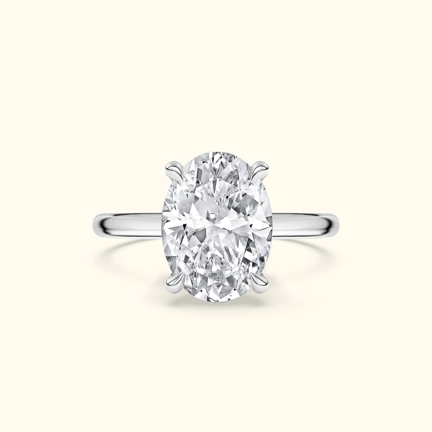 Oval diamond engagement ring set in a sleek silver band.