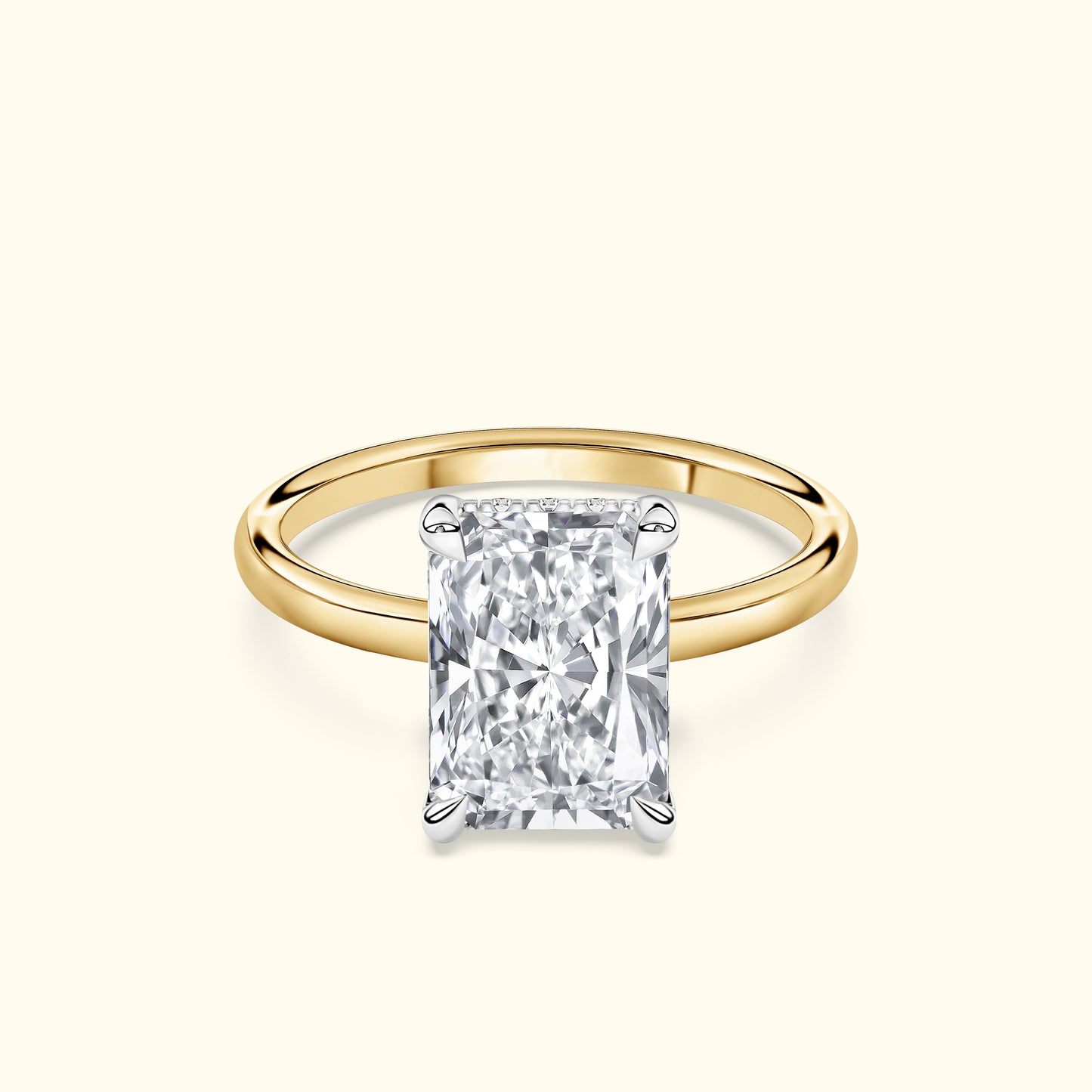 Rectangular diamond engagement ring with a gold band.