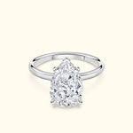 Elegant pear-shaped diamond ring set in a sleek silver band.