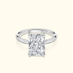 Stunning rectangular diamond engagement ring set in a sleek silver band.