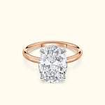 Oval diamond engagement ring set in a rose gold band.