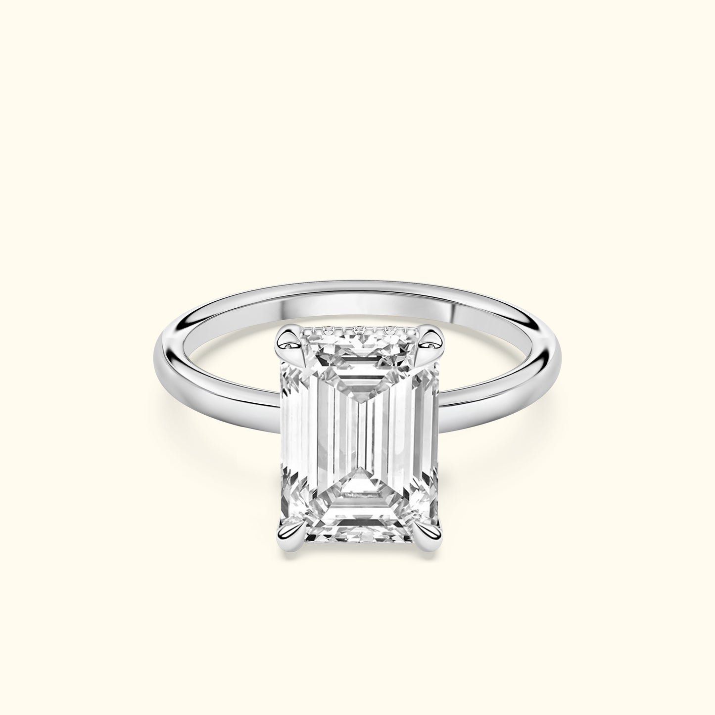 Elegant emerald-cut diamond ring set in a smooth white gold band.