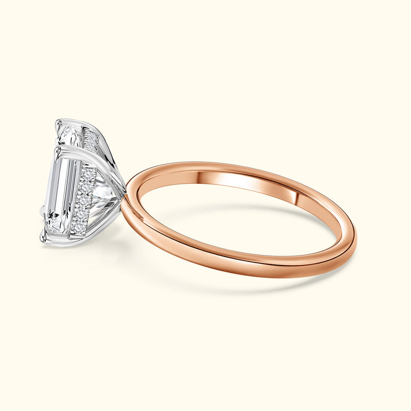Elegant two-tone engagement ring featuring a large rectangular diamond and a rose gold band.