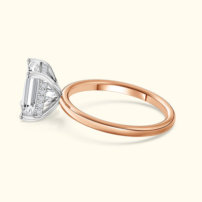 Elegant two-tone ring featuring a large rectangular diamond atop a rose gold band.