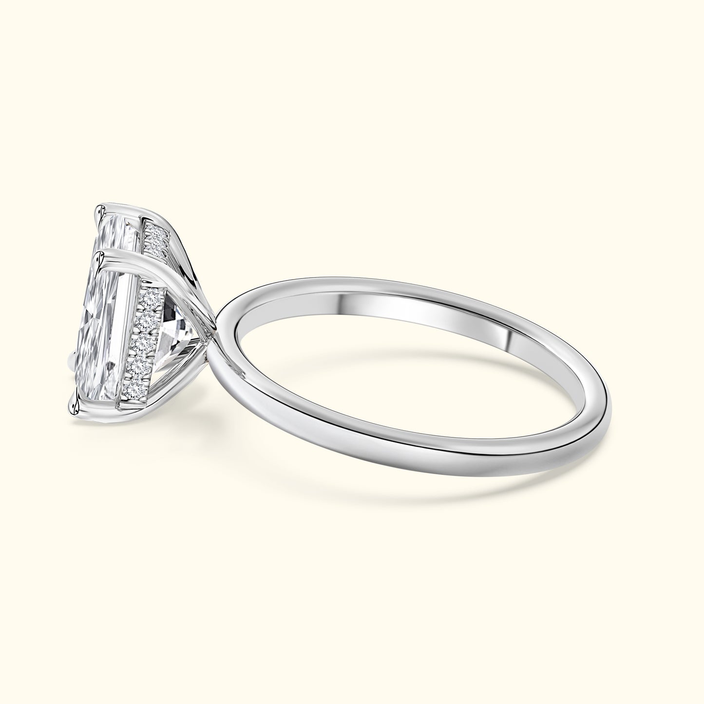 Elegant silver ring with a large, sparkling rectangular diamond and intricate band details.