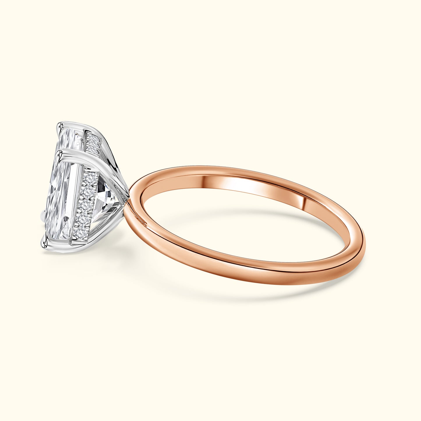 Elegant diamond ring featuring a sparkling rectangular center stone and rose gold band.