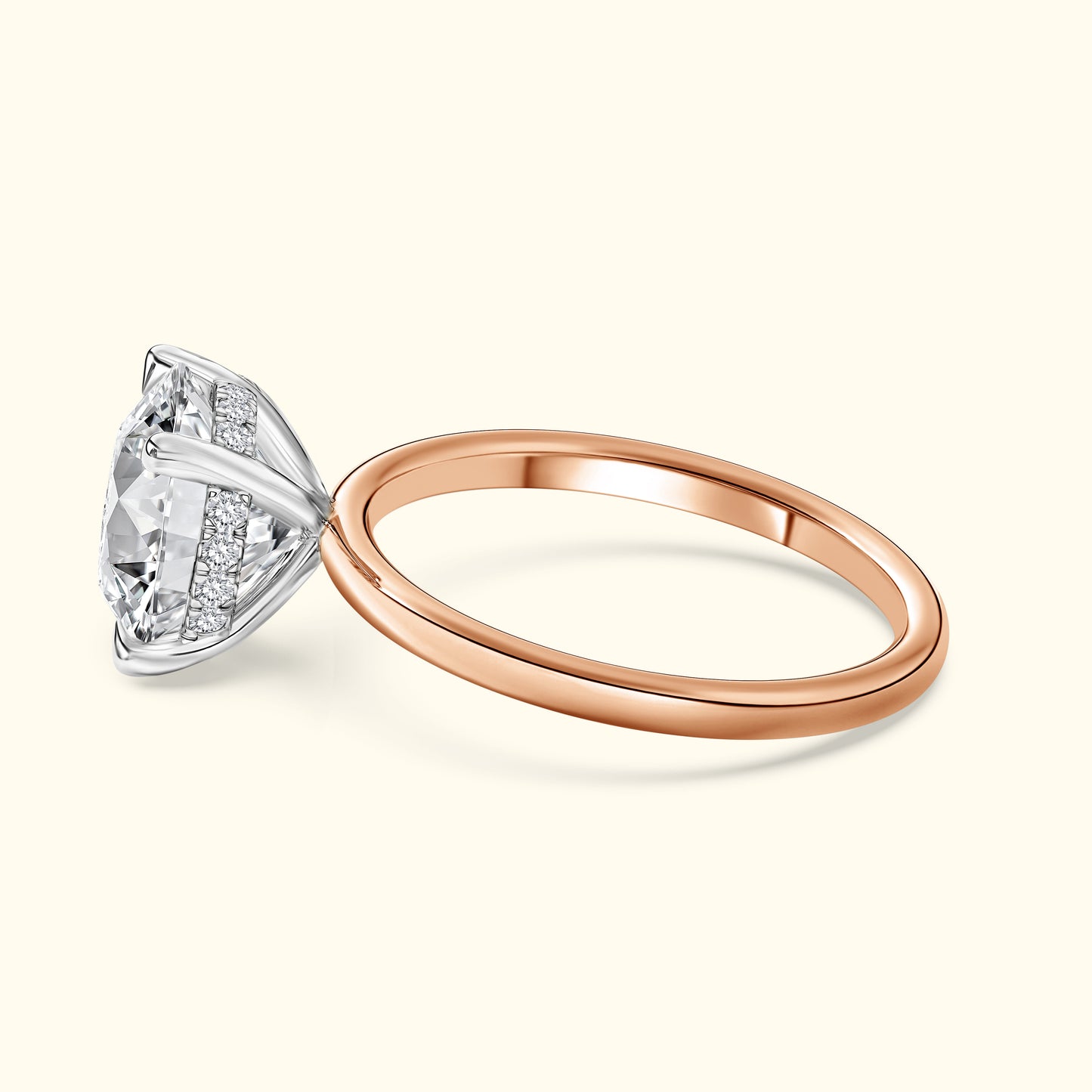 Rose gold engagement ring featuring a large diamond with a decorative band.