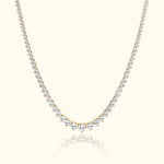 Elegant gold necklace adorned with sparkling diamonds, featuring a graduated design.