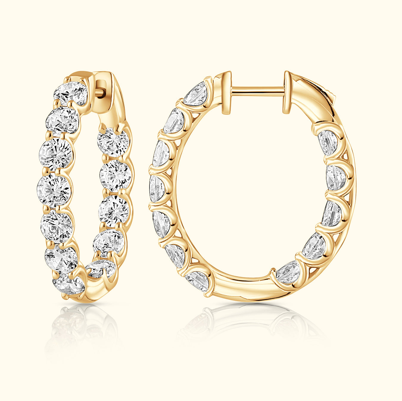 Gold hoop earrings adorned with sparkling diamonds, showcasing elegant craftsmanship.