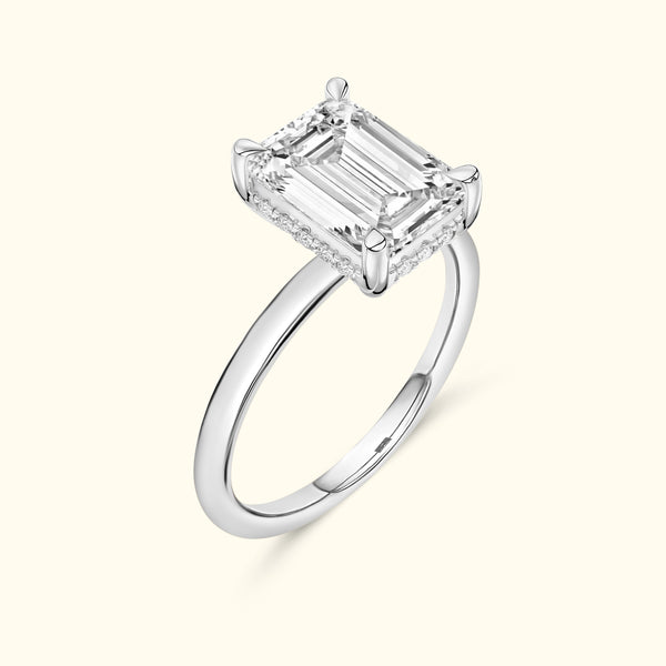 Elegant silver ring featuring a large emerald-cut diamond set on a smooth band.