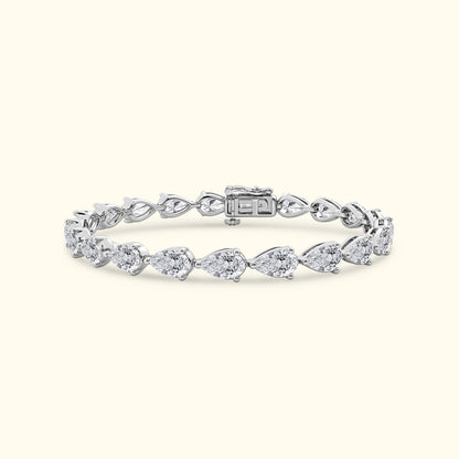 Silver bracelet with pear-shaped diamonds in a delicate arrangement.
