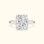 Elegant rectangular diamond ring set in a polished silver band against a light background.