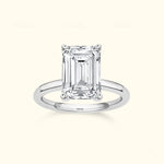 Elegant emerald-cut diamond ring set in a sleek silver band.