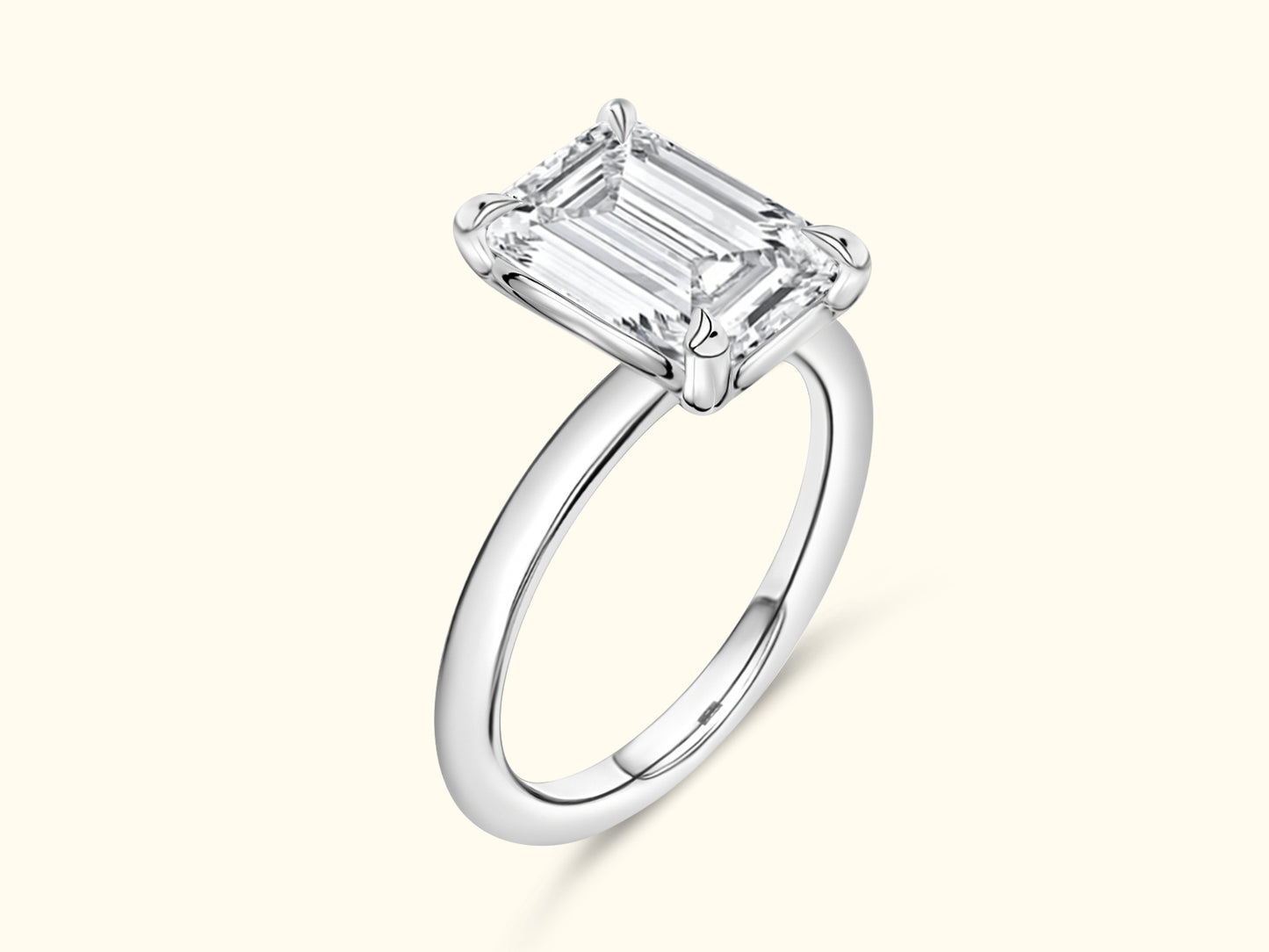 Elegant silver ring featuring a large emerald-cut diamond setting.