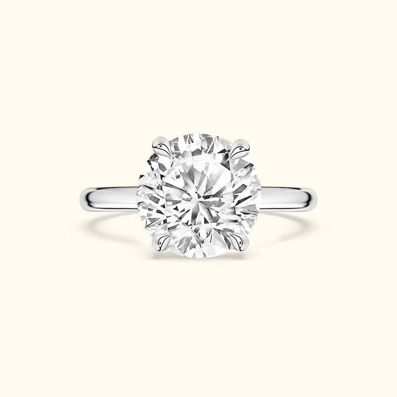 Elegant solitaire diamond ring with a round cut and silver band.