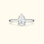 Elegant pear-shaped diamond ring with a sleek silver band.