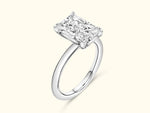 Diamond engagement ring with a rectangular cut stone set in a sleek silver band.