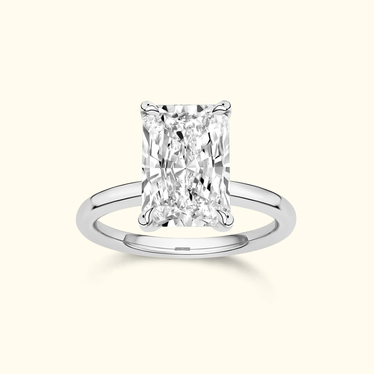 Rectangular diamond engagement ring with a sleek white gold band.