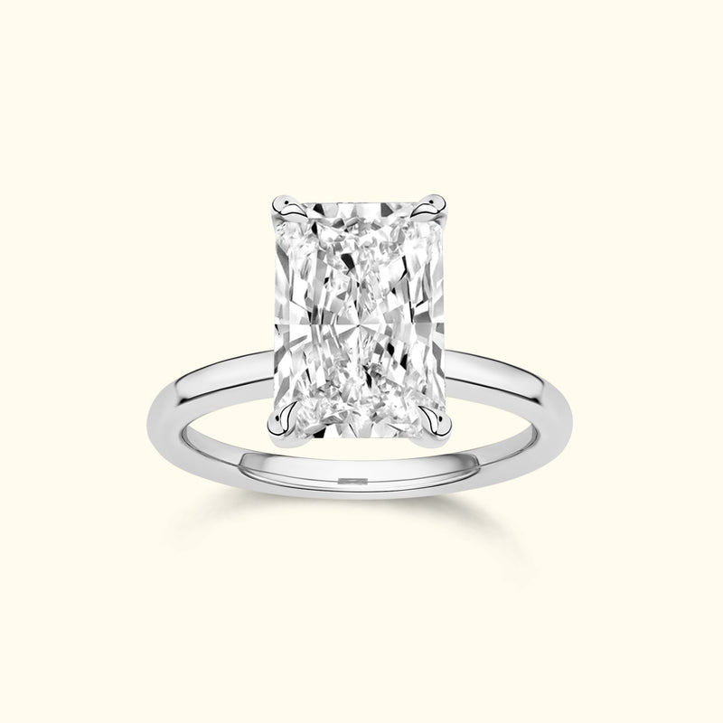 Rectangular diamond engagement ring with a sleek white gold band.