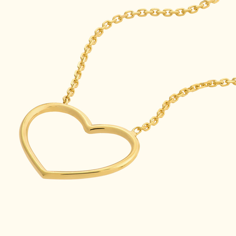 Golden heart-shaped pendant on a delicate chain.