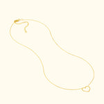 Delicate gold necklace featuring a simple heart pendant.