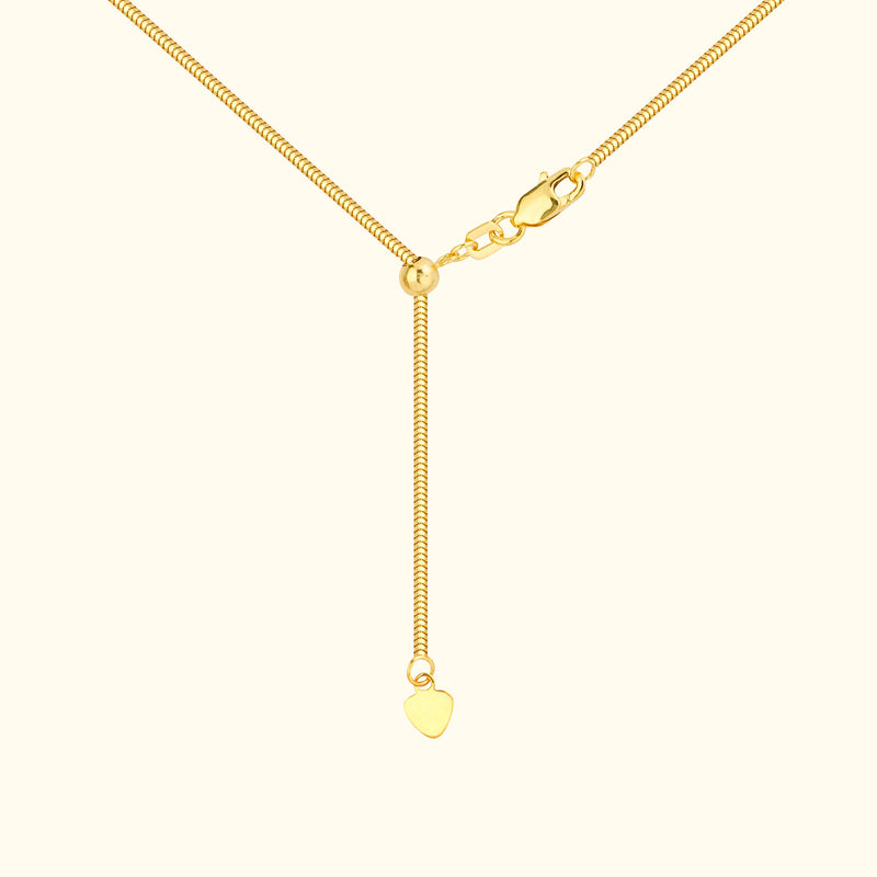 Gold necklace with a heart pendant and a lobster clasp.
