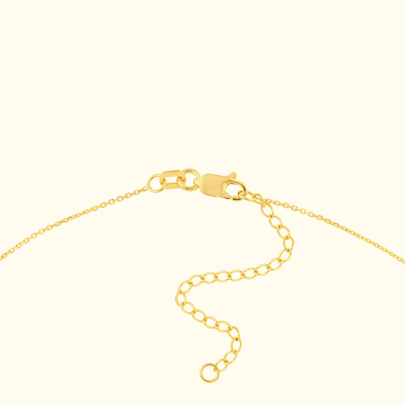 Gold clasp and chain of a necklace, featuring an adjustable link section.