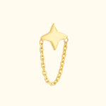 Gold star-shaped ring connected by a delicate chain.